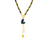 Gold-tone heart pendant necklace with black heart charm and pearl-to-gold ball drops