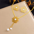 Gold-tone flower necklace with two pearl drops and matching stud earrings
