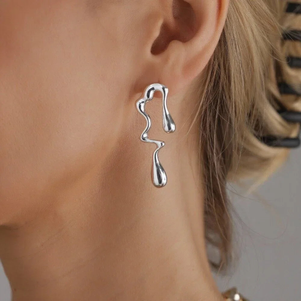 Silver drop earrings with wavy lava-inspired shapes