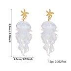 Jellyfish drop earrings with gold starfish tops and white jellyfish pendants