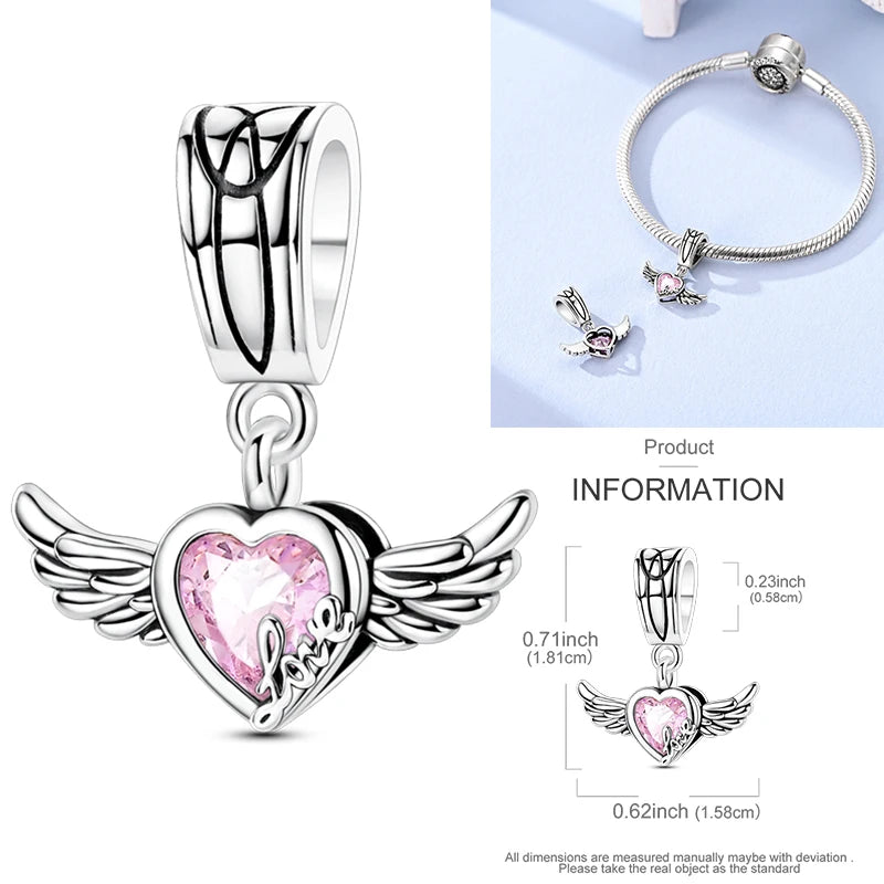 Sterling silver heart charm bead with pink gemstone and winged surround