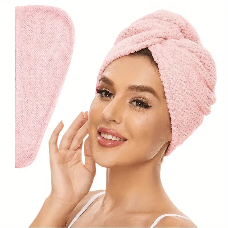 Pink absorbent hair towel wrap on head with rolled turban style and textured weave