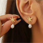 Boucles d'oreilles pendantes bohème à pompons — Étoile de mer et coquillage