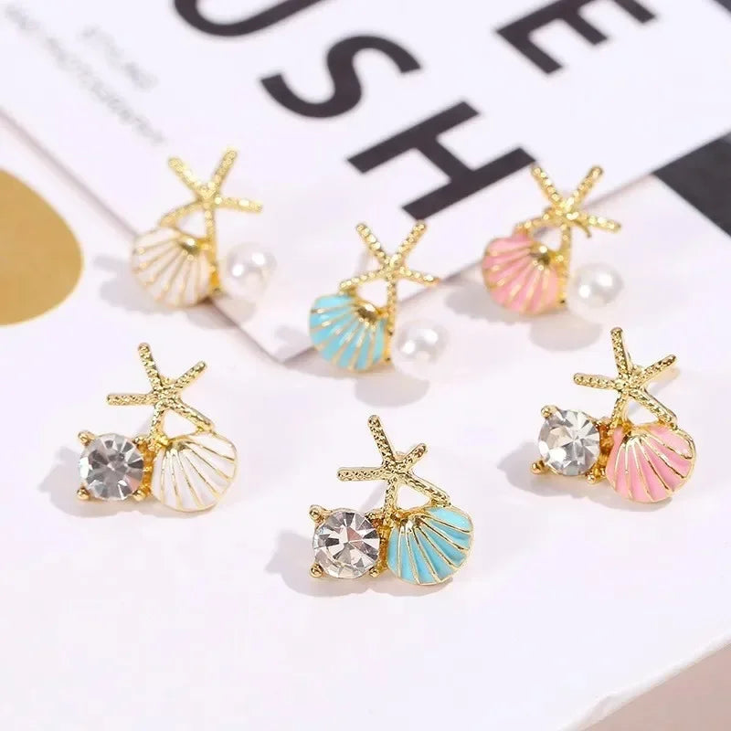Boucles d'oreilles pendantes bohème à pompons — Étoile de mer et coquillage