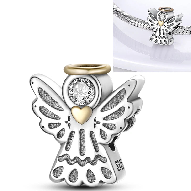925 sterling silver angel charm with white round center stone and heart detail
