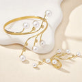 Gold-tone pearl bracelet and cuff-style ring with white pearl bead drops
