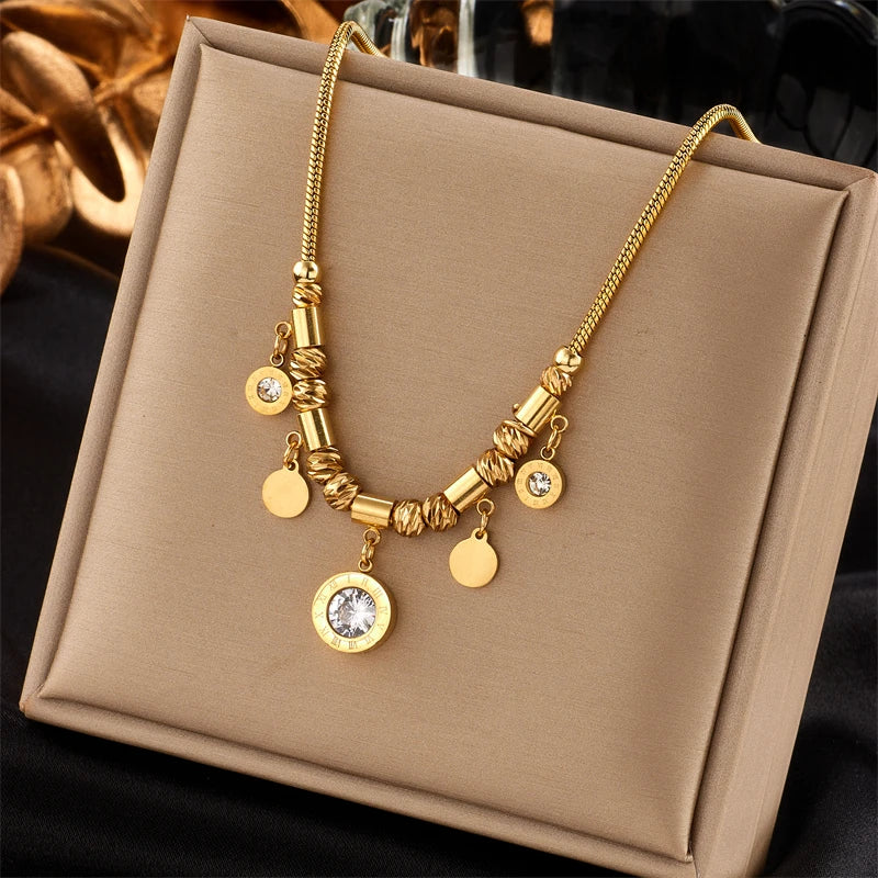 Zircon pendant necklace on jewelry bag: gold-tone chain with round charm drops
