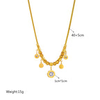 Gold-tone beaded necklace with round coin charms and blue zircon pendant