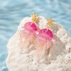 Gold starfish jellyfish earrings with layered pink jelly and clear translucent tentacles.