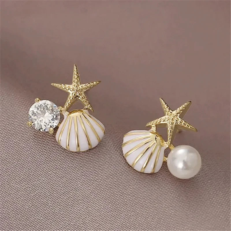 Boucles d'oreilles pendantes bohème à pompons — Étoile de mer et coquillage