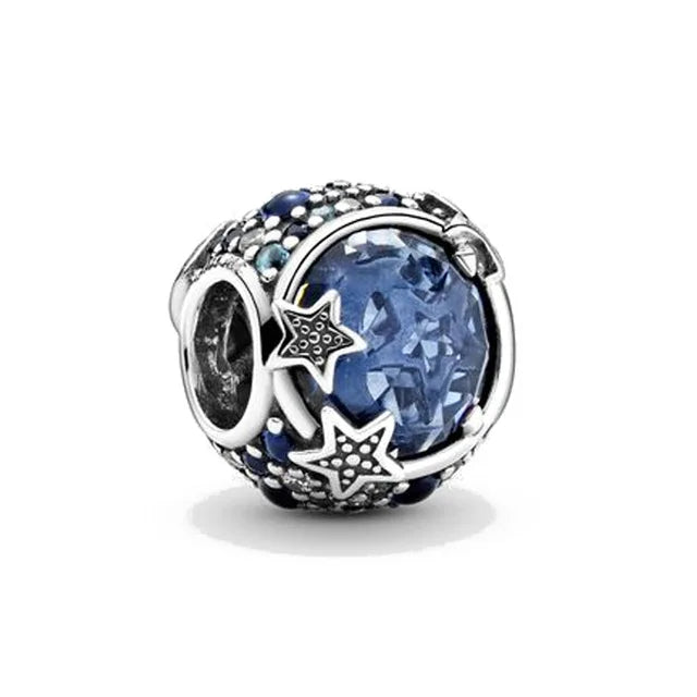 925 sterling silver charm bead with large blue gemstone center and star accents