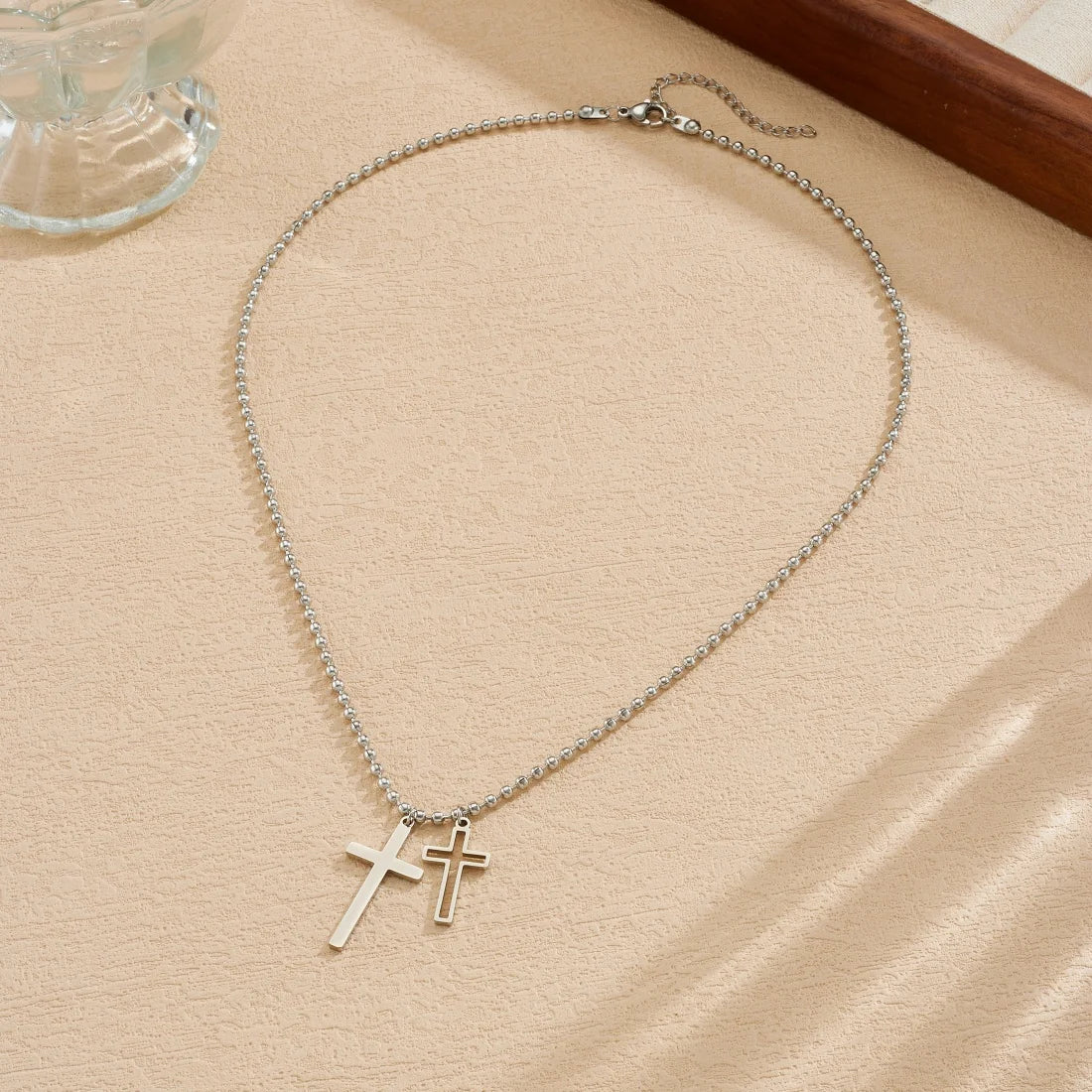Silver cross pendant necklace with double cross charm on a fine chain
