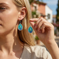 Teardrop seahorse shell earrings with green and blue enamel, silver-tone border, dangle