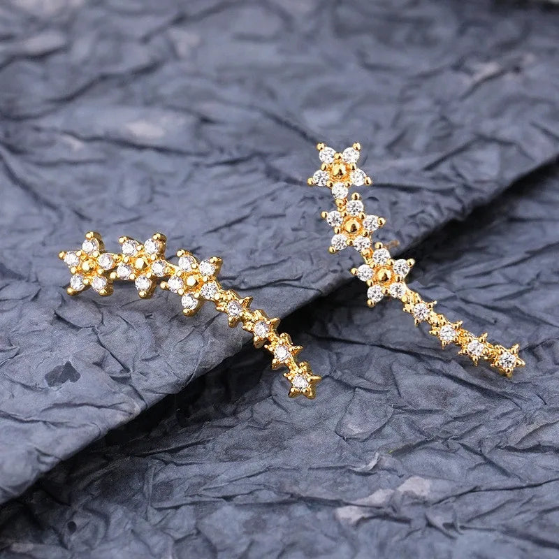 Gold daisy rhinestone ear climber earrings with white stones