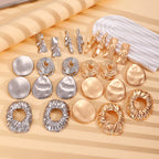 Assorted metal earrings with round discs and hoop styles in gold and silver