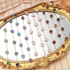 Gold flower bracelet with multicolor enamel charms and chain links
