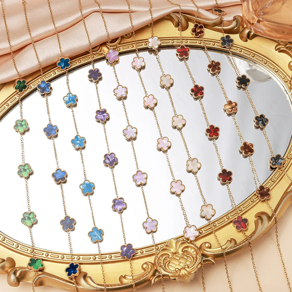 Gold flower bracelet with multicolor enamel charms and chain links