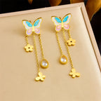Enamel butterfly stud drop earrings with gold chains, flower charms, and crystal teardrops