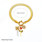 Gold-tone rose flower pendant necklace with red and blue enamel heart charms