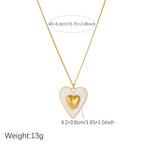 Gold chain necklace with white enamel heart pendant and gold inner heart