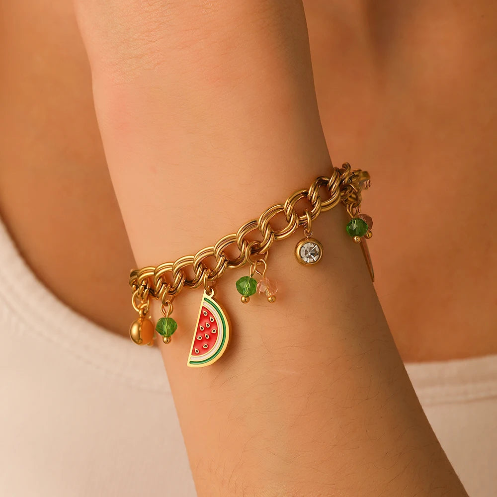 Watermelon enamel charm bracelet-style view with gold-tone chain and watermelon pendants