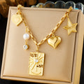 Gold-tone multi-charm necklace with heart, star, square pendant, pearl drop and zircon