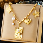 Gold-tone multi-charm necklace with heart, star, square pendant, pearl drop and zircon