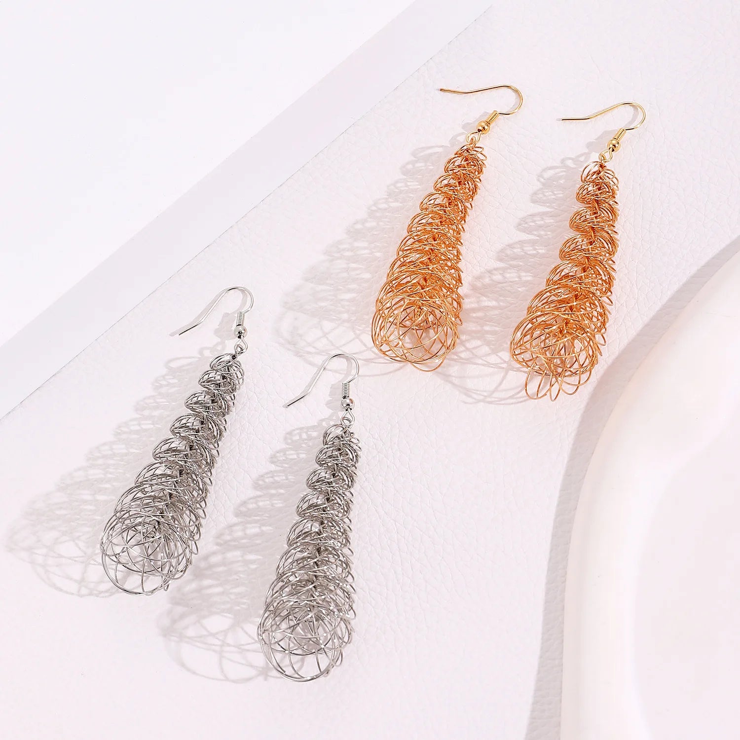 Wire teardrop drop earrings in silver and gold, looped strand design