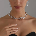 Silver-tone lava drip choker necklace and drop earrings