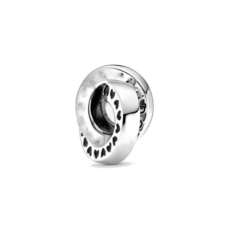 925 sterling silver charm bead with heart cutout pattern and dark central inset