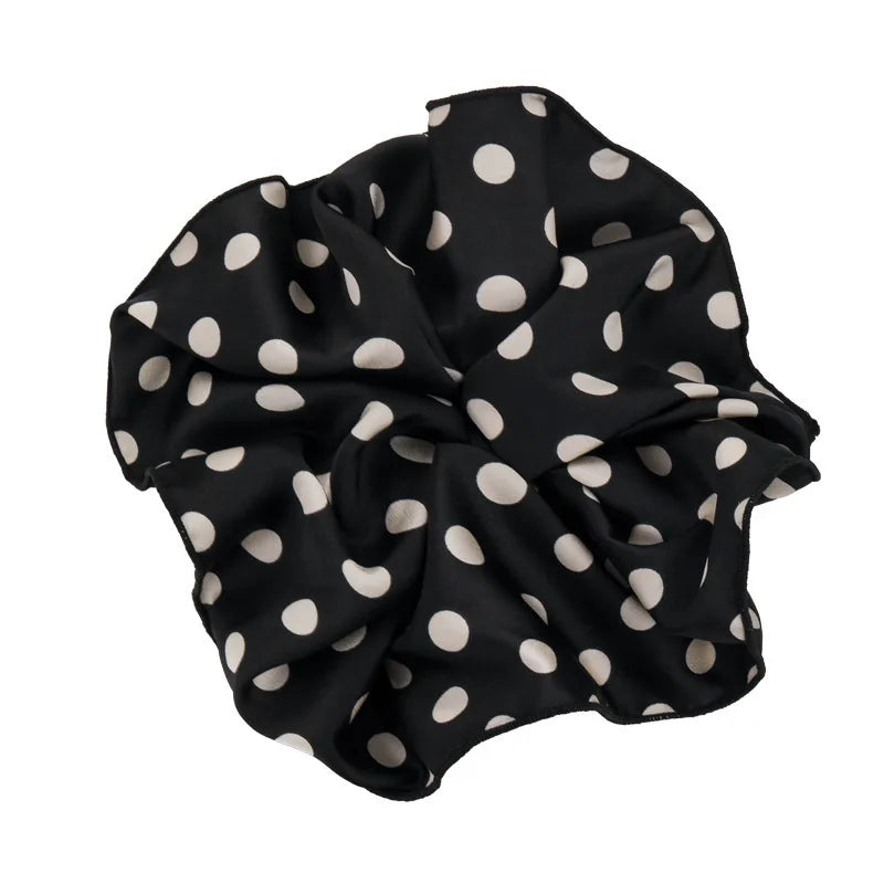 Polka dot black scrunchie with a soft bow knot and elastic gathered center