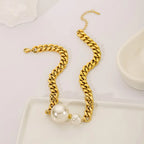 Gold-tone Cuban chain pearl necklace with two centered round pearls and linked pattern