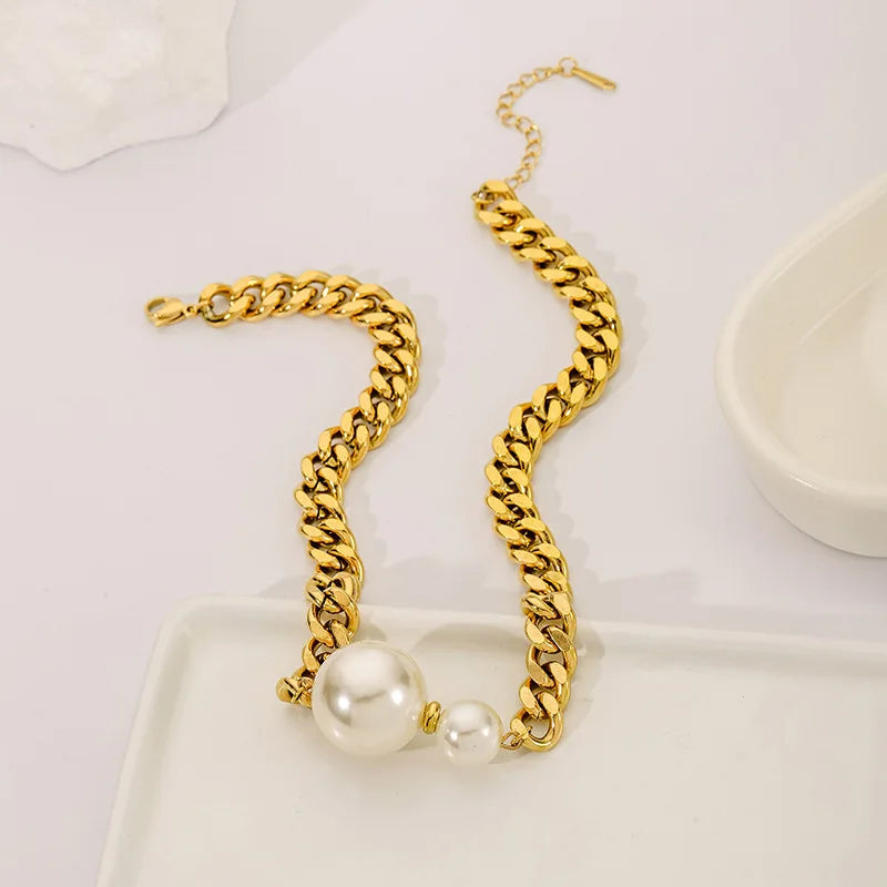 Gold-tone Cuban chain pearl necklace with two centered round pearls and linked pattern