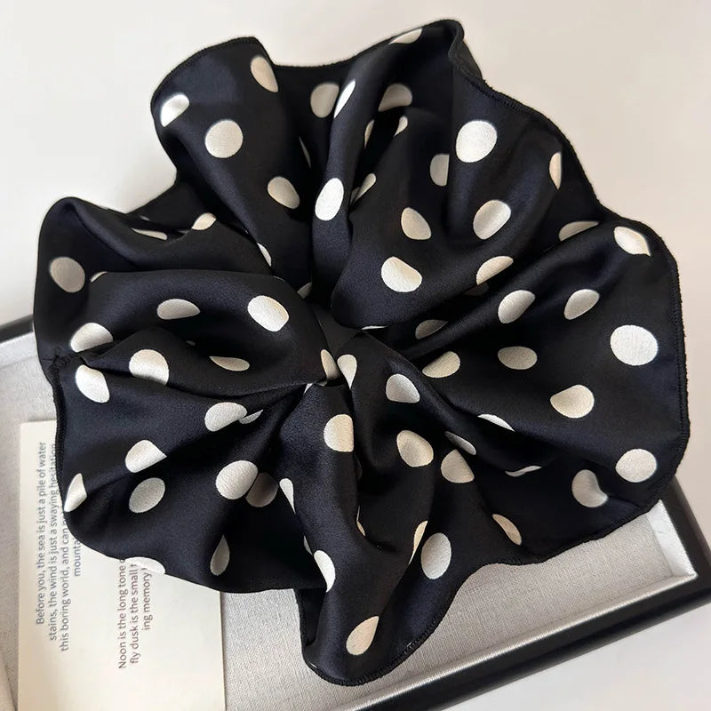 Polka dot black scrunchie set with large fabric bows and elastic gathers