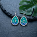 Teardrop seahorse earrings with teal enamel center, silver-tone hooks
