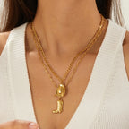 Gold-tone double-layer pendant necklace with cowboy hat and boot charms