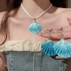 Blue shell pendant necklace with gold starfish dangle earrings, scallop shell drops