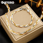 Two-tone snake-chain necklace and bracelet set, gold and silver twisted links with clasps