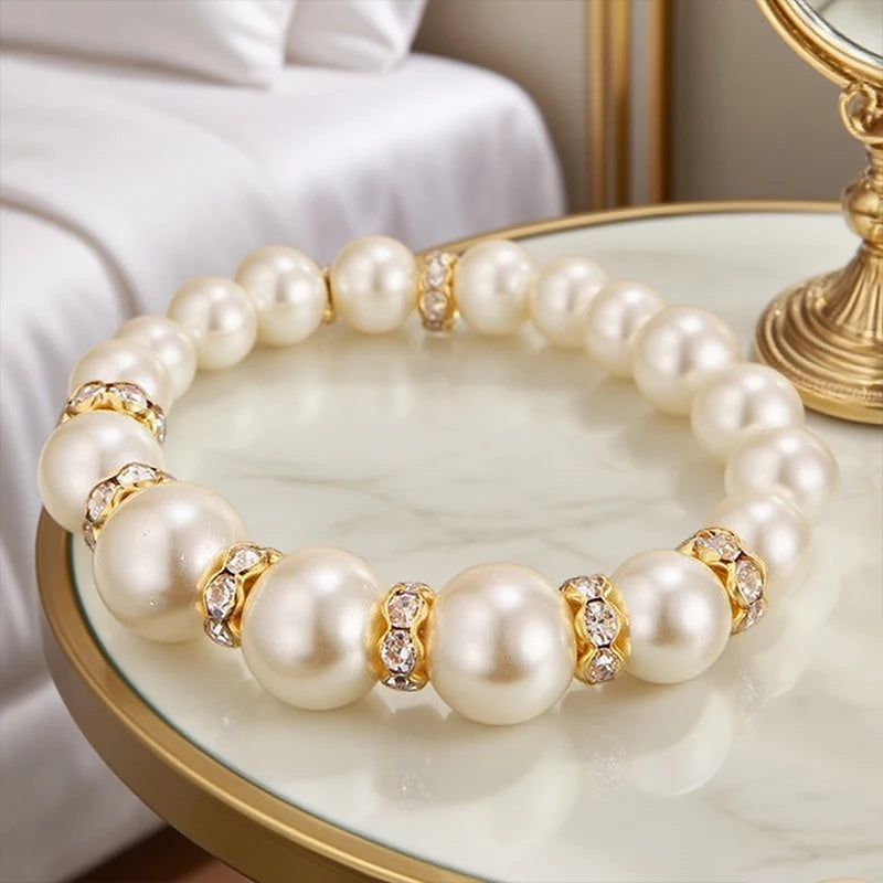 Pearl bracelet with round pearls and gold-tone crystal bead spacers