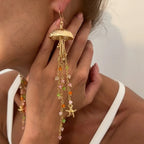 Boucles d'oreilles pendantes bohème à pompons — Étoile de mer et coquillage