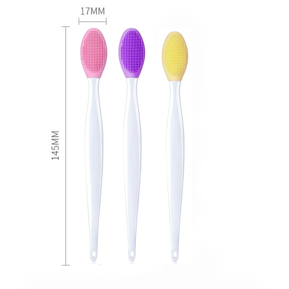 Three silicone cleansing brushes with white handles and pink, purple, yellow oval heads