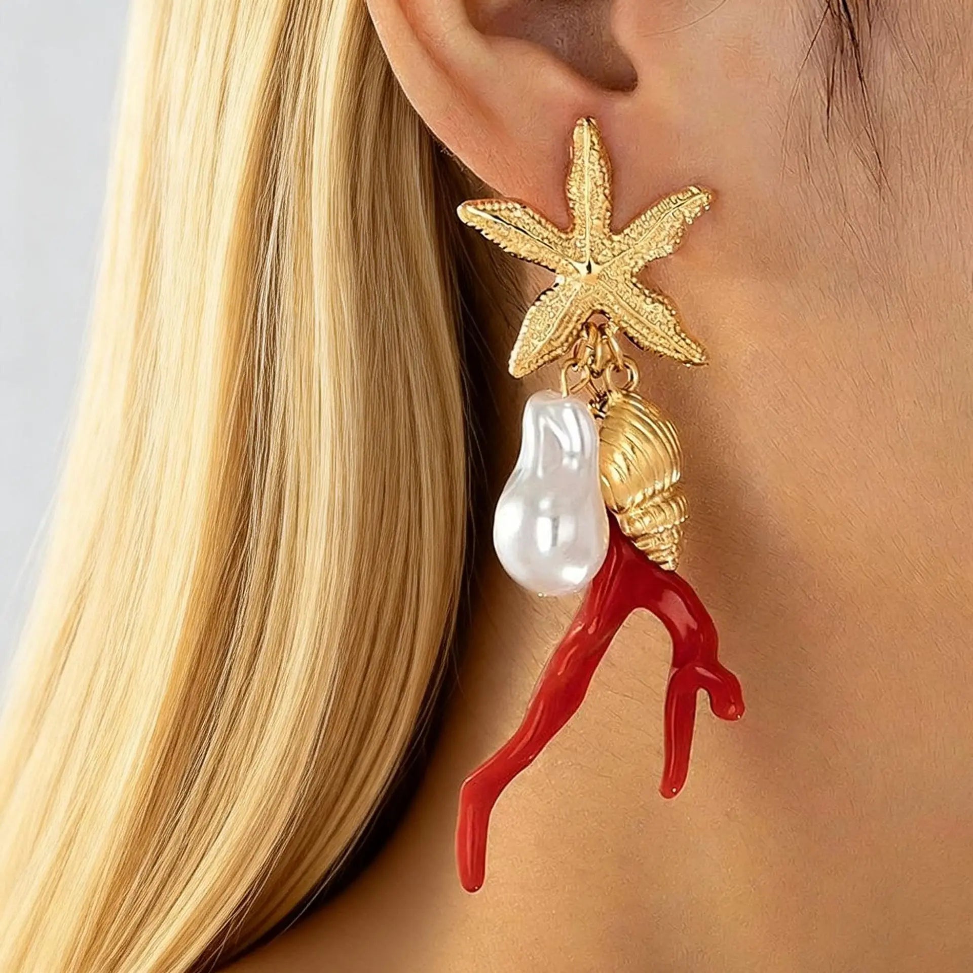 Star-and-figure resin earrings with red coral drops, white pearls, gold-tone finish