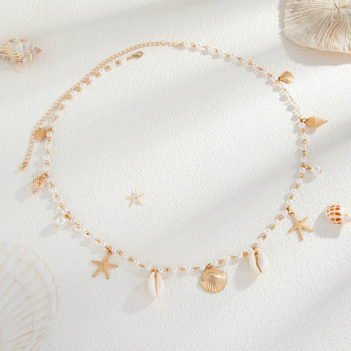 Pearl belly chain with shell and starfish charms, gold-tone beaded links