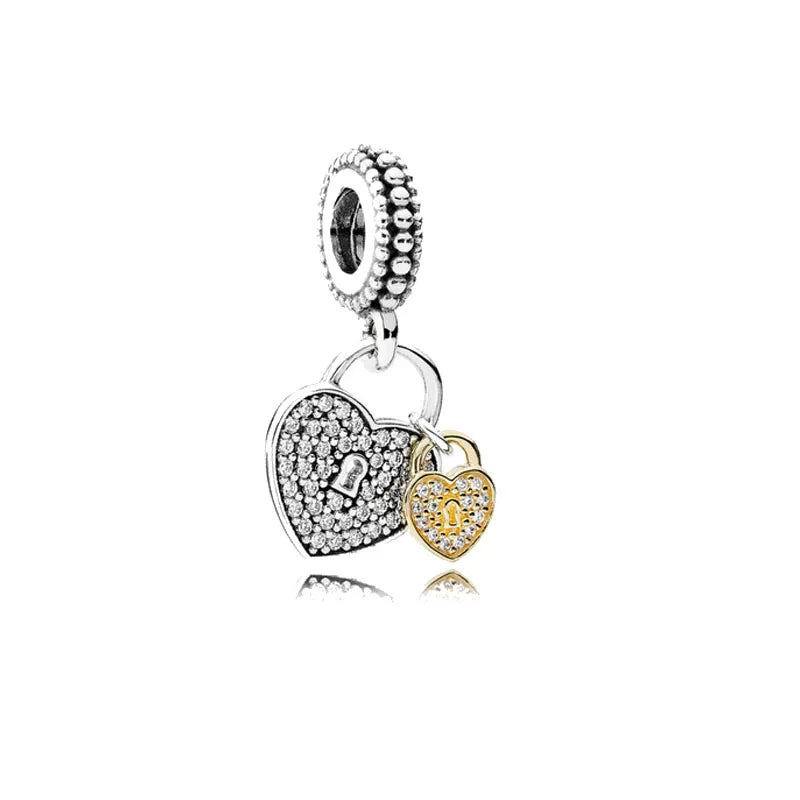 Silver-tone heart charm bead with clustered stones and a dangling padlock charm