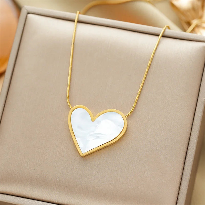 Gold-plated necklace with a white heart shell pendant
