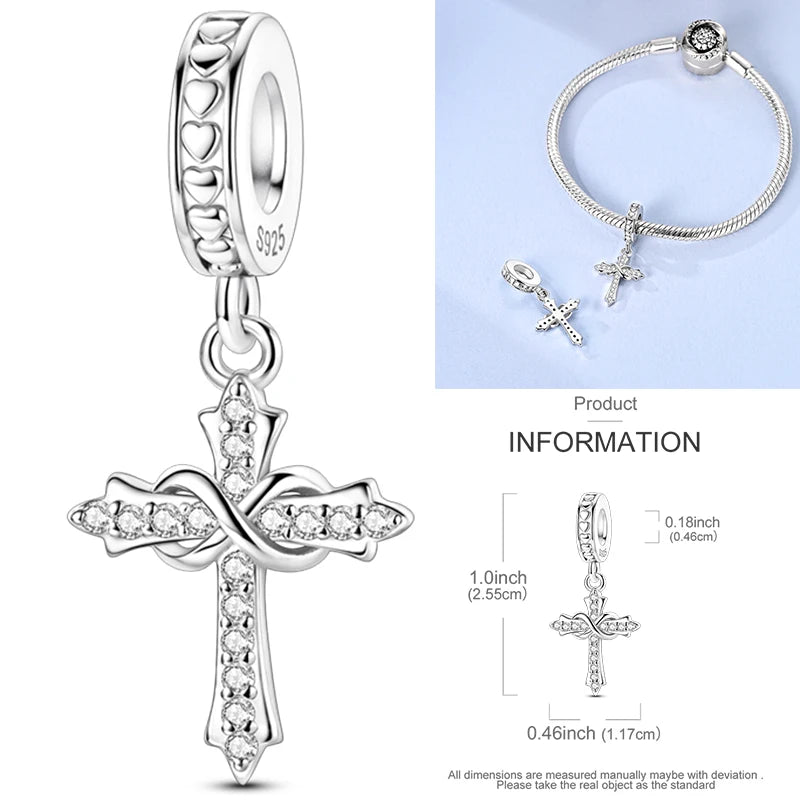 Sterling silver cross charm bead with crystal-studded ribbon-like wings