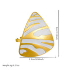 Gold-tone white tiger stripe ring with teardrop face, cutout striped design