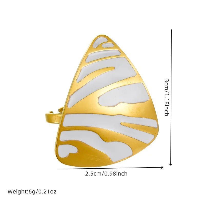 Gold-tone white tiger stripe ring with teardrop face, cutout striped design