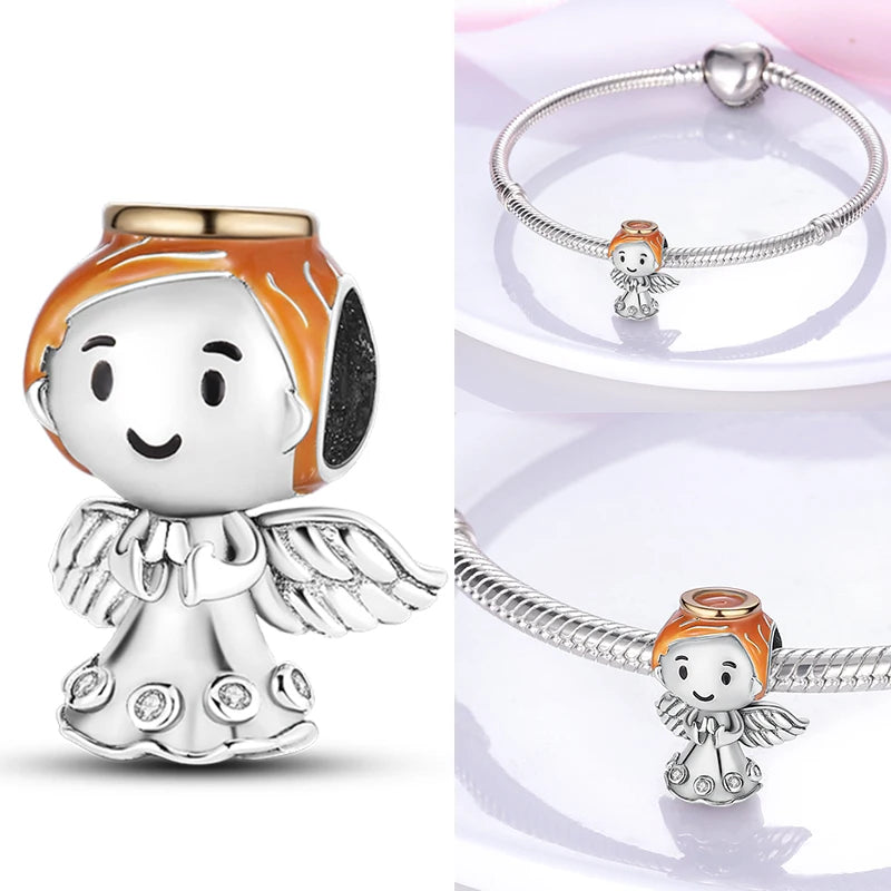 Sterling silver angel charm with orange hair and winged outfit