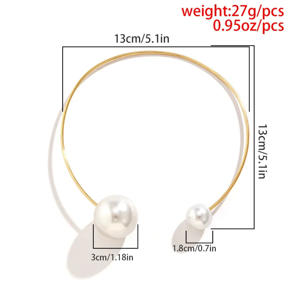Gold-tone pearl collar necklace with round white beads on a thin loop chain